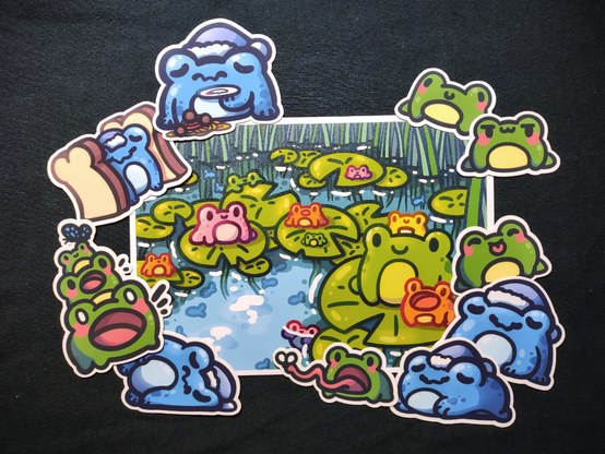 A print of frogs in a pond surrounded by frog stickers.
