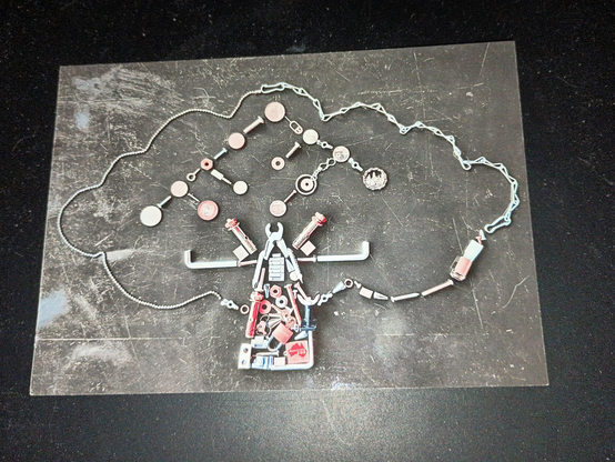 Front of postcard representing the tree from the Software Freedom Conservancy.
It is made of chain-links, nails, hex tools and a pair of pliers.   