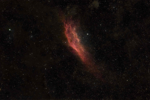 Nebula stretching up and down the screen, that very much resembles the state of California on a map. Lots of reds and oranges and yellows in the image.