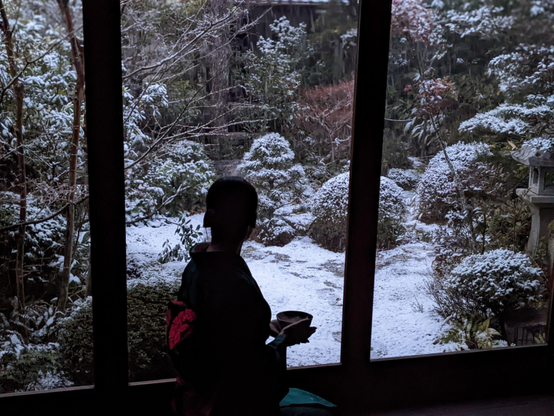 Nao-san enjoys a morning matcha, looking at a snowy teahouse garden.