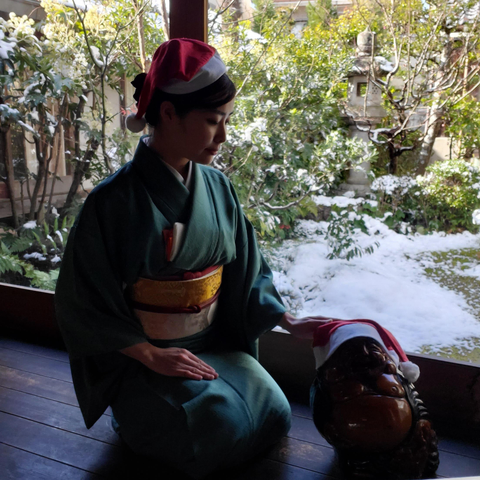 Nao-san (in kimono) and our adorable statue of Hotei model in Santa hats.