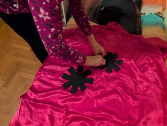 Grandma putting pins in the second asterisk.