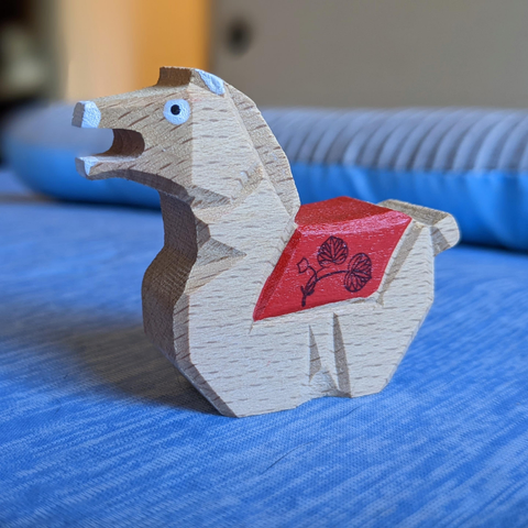 A wooden horse shaped omikuji holder (the mouth would hold the rolled up fortune) from Kamigamo-jinja.
