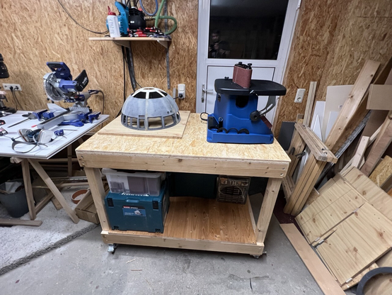 A selfmade rolling workbench with a R2-D2 dome and an oscillating Spindel sander. 