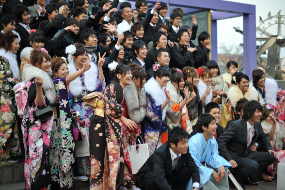 A group of 20 year olds posing for a group photo on Coming-of-Age Day.
