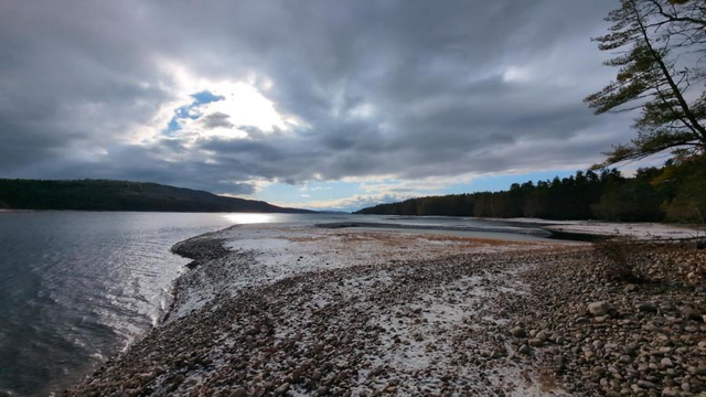 
Deep wood lake and mountains.