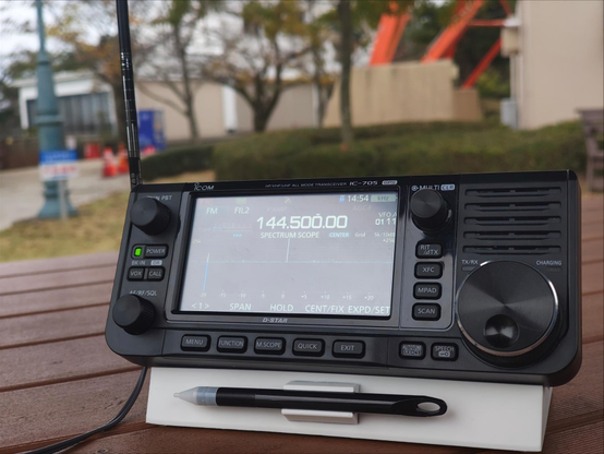 Icom IC-705 put on a table outside in the park