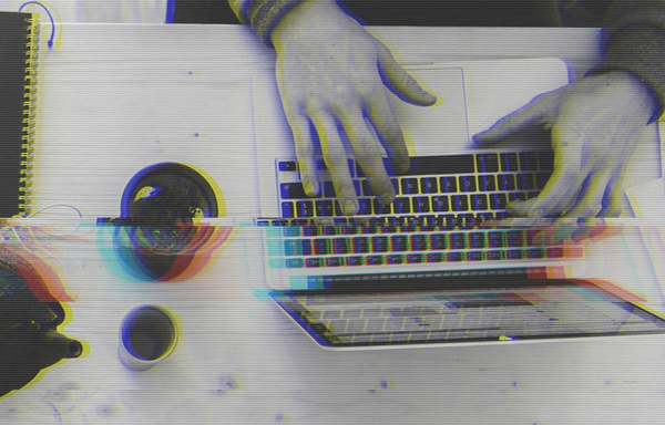 Part of Technically Good's header image. A table seen from above, with laptops, cups, notebooks, and other items. The image is black and white and glitched in appearance.

Original photo by Marvin Meyer via Unsplash.