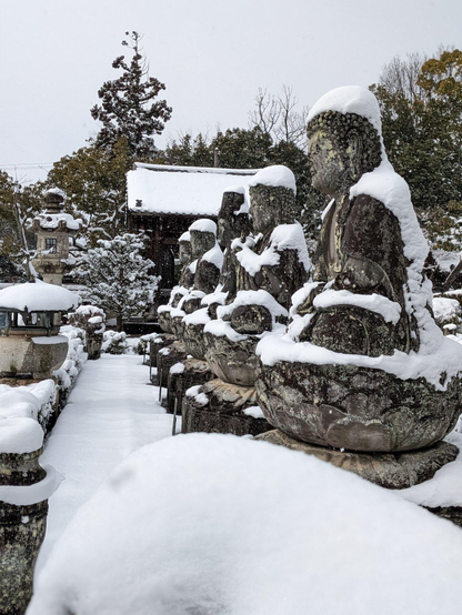 Renge-ji's statues garbed in snow.