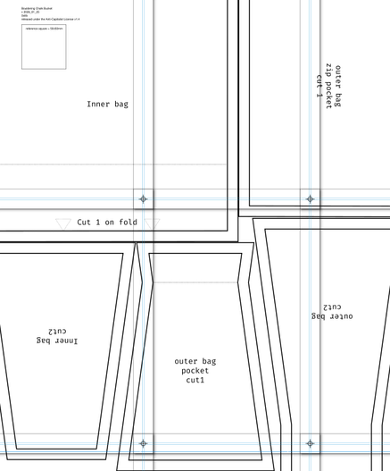 A fabric pattern layed out on A4 pages. Each one is overlapped a bit, with a cross and circle in the corner.