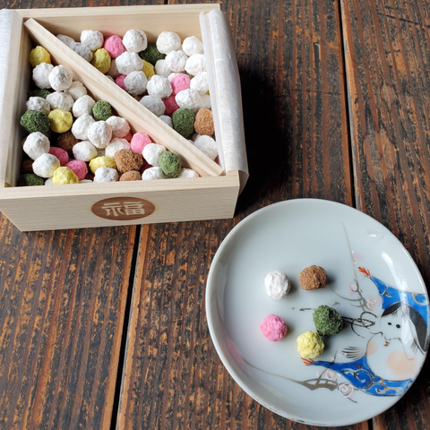 A masumame filled with colourful, sugar covered soybeans.