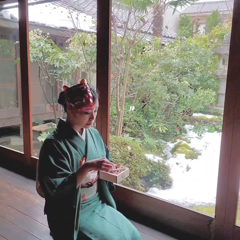 Nao-san, in an oni mask, munches on lucky (sugar covered) soy beans.