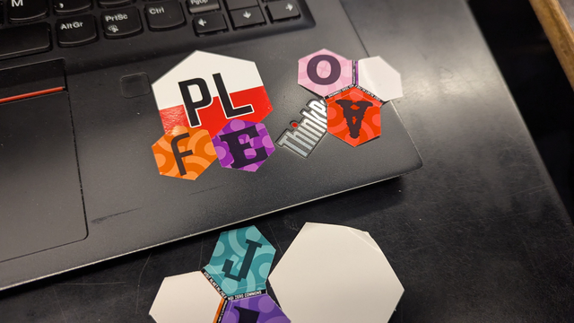 a pl-fe sticker made of a Polish flag sticker with the letters PL and two stickers with letters F and E
