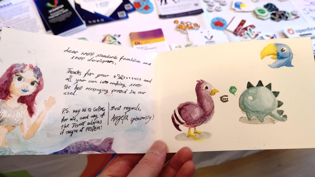 Unfolding the letter shows a hand-drawn (aquarell) mermaid and the logos of multiple XMPP chat apps such as Conversations, Dino and Snikket. The text admires the work of the quote "best messaging protocol" and sends regards from Angela to Ge0rG, a long-term comunity and the disroot.org admins.