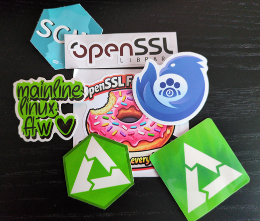 A bunch of sticker: OpenSSL, PostmarketOS and Thunderbird