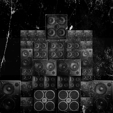 Wall of speakers in b/w.