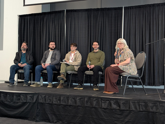 A photo of a panel on stage with Robert Gehl, Chad Ohman (mstdn.ca), Jordan (MacEwan U), Django (cosocial.ca), and Karen Keiller (MacEwan U).