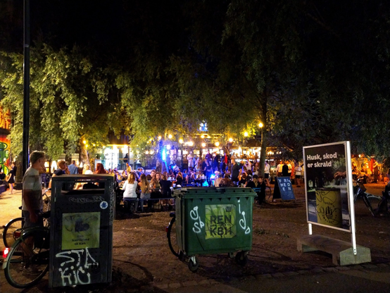 Cafe Friheden after dark, Norrebro, Copenhagen - people & lights among the trees