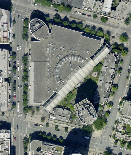 a satellite imagery of International Village mall with a solar clock in the middle