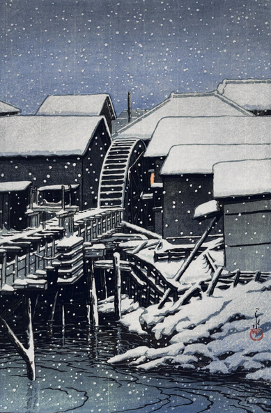 Snow falls on industrial buildings on the banks of Tokyo's Kanda River, on a dim winter evening. A layer of fresh snow lies across the rooftops of buildings crowded near the water's edge; in the center of the image, the wheel of a watermill is still, its blades gathering snow. A single light shines in one window at the mill, but the scene is quiet and deserted