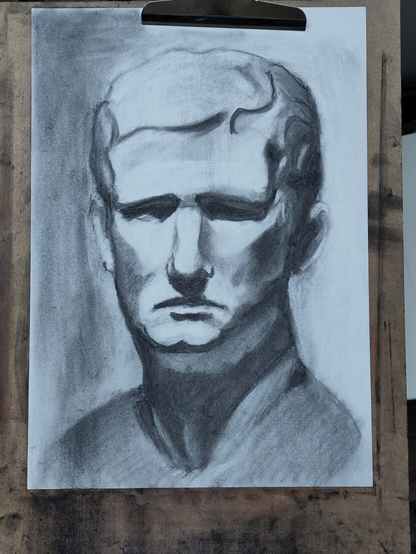 Portrait of man from cast done in charcoal
