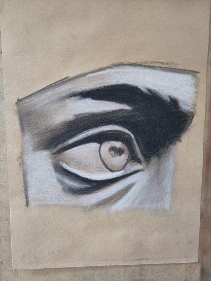 Detail from the eye of Michelangelo's David in charcoal and white chalk on toned paper