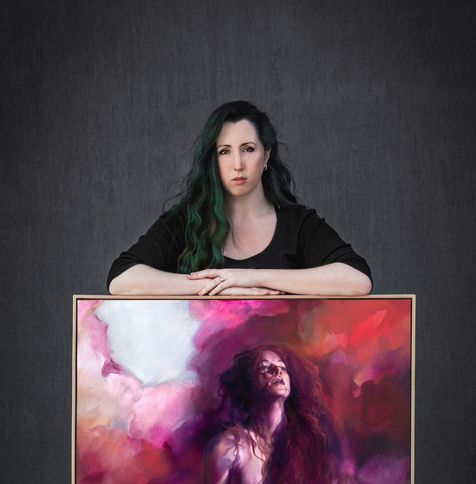 The artist (Liz a pale woman with long dark green hair) stands behind a large painting of a figure in magentas, with her arms crossed on the top edge of the wooden frame, she looks satisfied and proud.