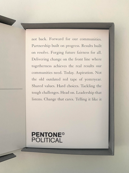 A PENTONE postcard for 'political', it says: 
not back. Forward for our communities.
Partnership built on progress. Results built on resolve. Forging future fairness for all.
Delivering change on the front line where togetherness achieves the real results our communities need. Today. Aspiration. Not the old outdated red tape of yesteryear.
Shared values. Hard choices. Tackling the tough challenges. Head on. Leadership that listens. Change that cares. Telling it like it
