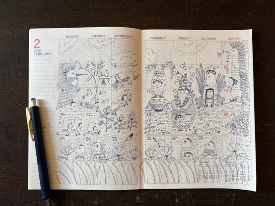 Open planner spreads display the month of February 2026, featuring illustrations of children dressed as peculiar birds gathering in fields where strange flowers bloom.