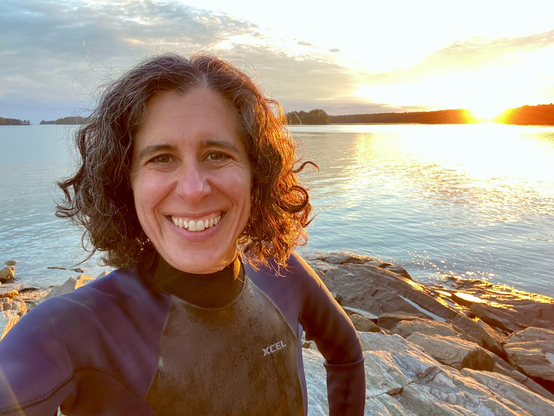 Selfie in a wetsuit at sunset over the sea