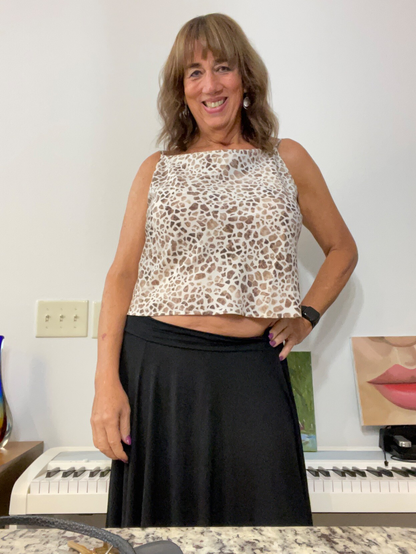 This was a selfie I took when I was living in Austin, TX. You can see a couple of my paintings. I’m wearing a giraffe print top and a big ass smile. 