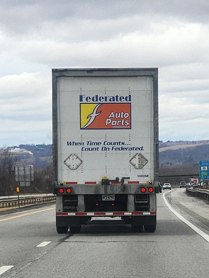 Photo on a new york highway of a truck that says "Federated auto parts. When time counts... count on federated"