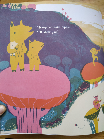 A page from Big Dance. Poppa and Pippa stand atop a pink tree/mushroom, holding hands. Poppa carries a sleeping little baby. Poppa explains that everyone has a dance inside them, and in response to Pippa asking 'everyone?' in a previous page, he replies 'Everyone', said Poppa. 'I'll show you'. 