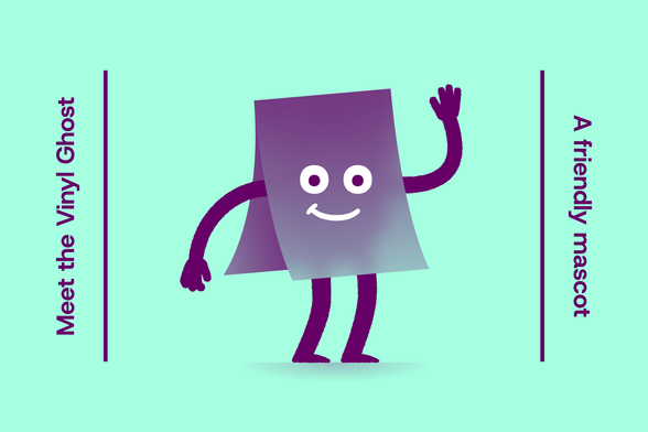 The Vinyl Ghost has a friendly look and is waving at you! It’s a small character, hidden under a sheet of translucent purple vinyl folded in half, with only limbs sticking out, and big eyes and a smile appearing through.