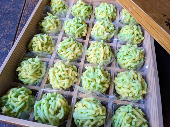 Green and yellow kinton sweets inspired by rapeseed flowers.