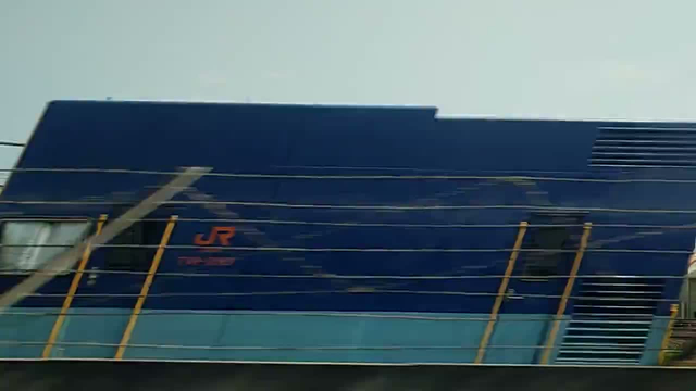 Video taken from the inside a bullet train in Japan, showing the outside places passing by very quickly.