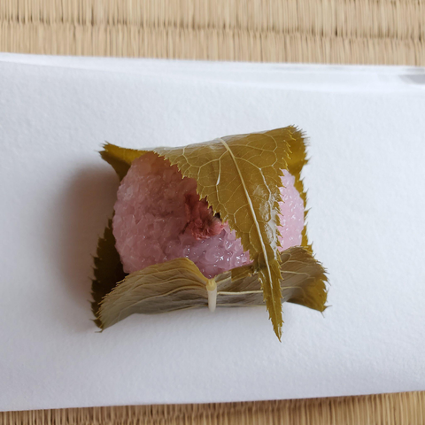 Sakuramochi, a sticky rice cake wrapped in a 'pickled' cherry tree leaf.
