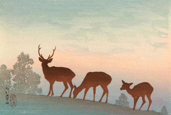 A misty rose-tinted sunrise on Wakakusa-yama in Nara. Three deer pause on a grassy hilltop, rendered in silhouettes by the sunrise beginning to paint the sky behind them. Nearby trees are indistinct, shadowy in the early morning light. Beyond the hill, the landscape of Nara disappears into the mist.