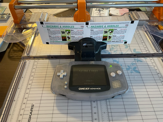 A dotcode card strip sitting in the ereader, which is showing the “scan card” screen