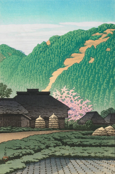 A spring morning on a farm somewhere in Izu, Japan. In the foreground, a flooded rice paddy has been seeded with tidy rows of plant shoots; beyond, a path leads between low green shrubs toward a series of traditional thatched-roof buildings. Beyond, the top of a cherry tree in bloom reaches up over the rooftops, while further on, healthy green forests cling to steep hillsides. Above, a few hazy white clouds cross a bright blue sky.