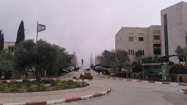Photo of the campus with Palestinian flag