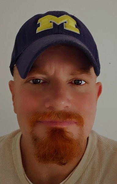 A close up of a man trying to figure out his new phone.