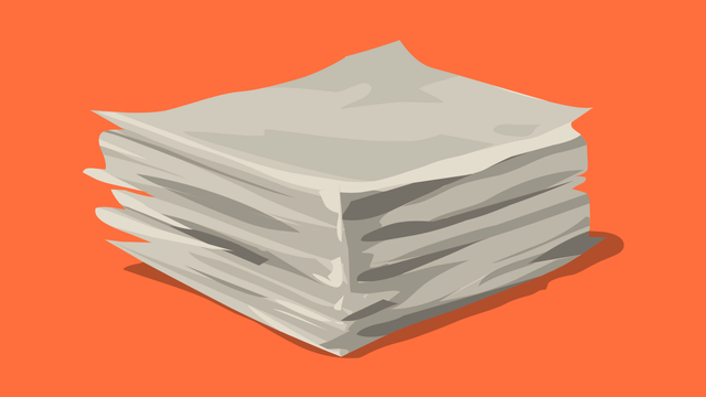 A stack of papers with an orange background