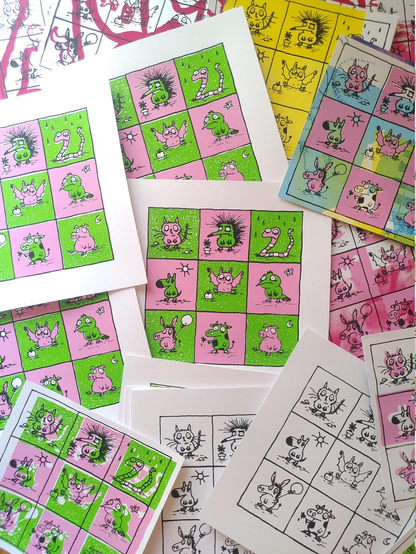 Silkscreen prints featuring depressed animals in pink and green.