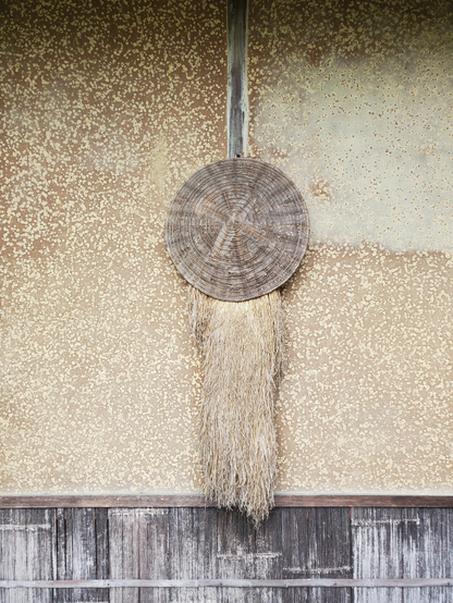 Straw raincoat and hat.