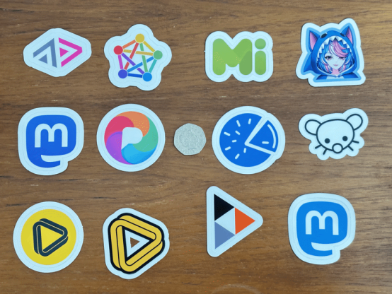 12 Fediverse Stickers compaired to a 50p coin.

Each Sticker being ~50mm
- ActivityPub
- Fediverse
- Misskey
- Sharkey
- Mastodon (Purple)
- PixelFed
- Piefed
- Lemmy
- Loops
- Loops (Big)
- PeerTube
- Mastodon (Blue)