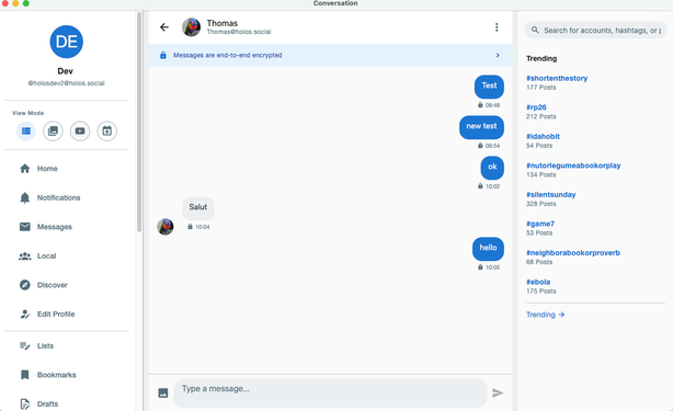 Screenshot of the Holos desktop interface showing an end-to-end encrypted conversation, with a navigation sidebar on the left and a trending hashtags panel on the right.