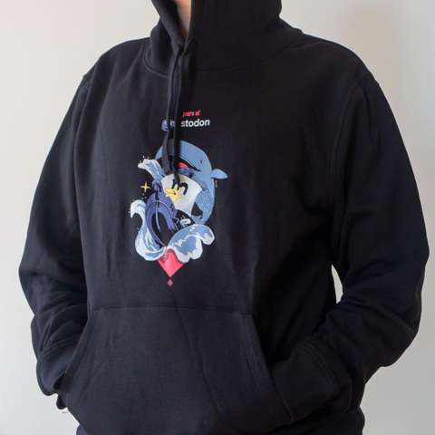 The same woman wearing a black unisex hoodie with an identical design.