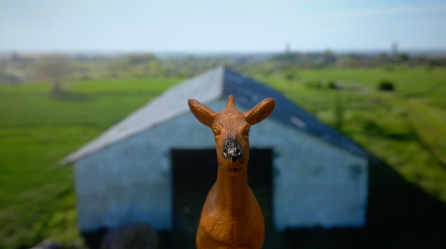 Animation still showing a plastic toy farm animal flying through the air.

Taken from: bgm - Afraid of Hay