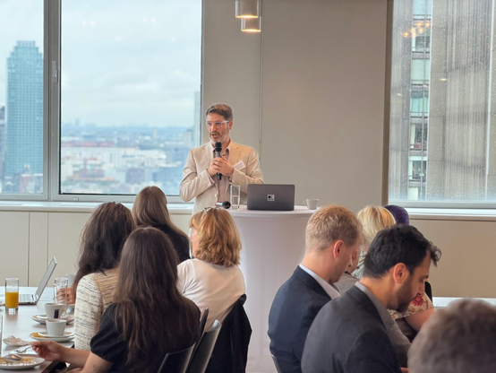 Bastien Guerry speaking at the breakfast reception.